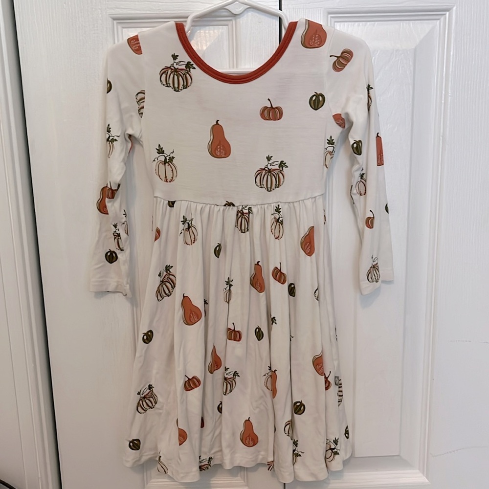 Kyte BABY Cream Dress with Orange and Green Pumpkin Print